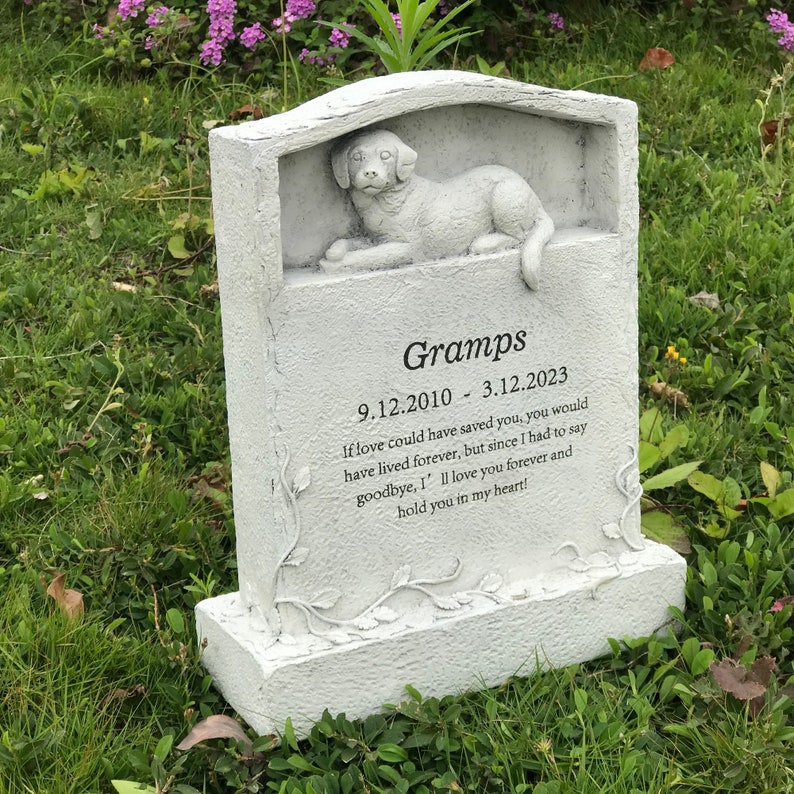 May include: White stone pet memorial with a carved dog and the inscription "Gramps 9.12.2010 - 3.12.2023 If love could have saved you, you would have lived forever, but since I had to say goodbye, I'll love you forever and hold you in my heart!"