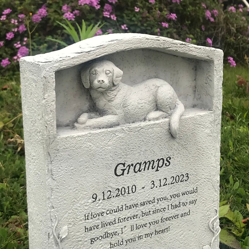 May include: A white stone memorial with a sculpted dog figurine. The inscription reads "Gramps 9.12.2010 - 3.12.2023 If love could have saved you, you would have lived forever, but since I had to say goodbye, I'll love you forever and hold you in my heart!"