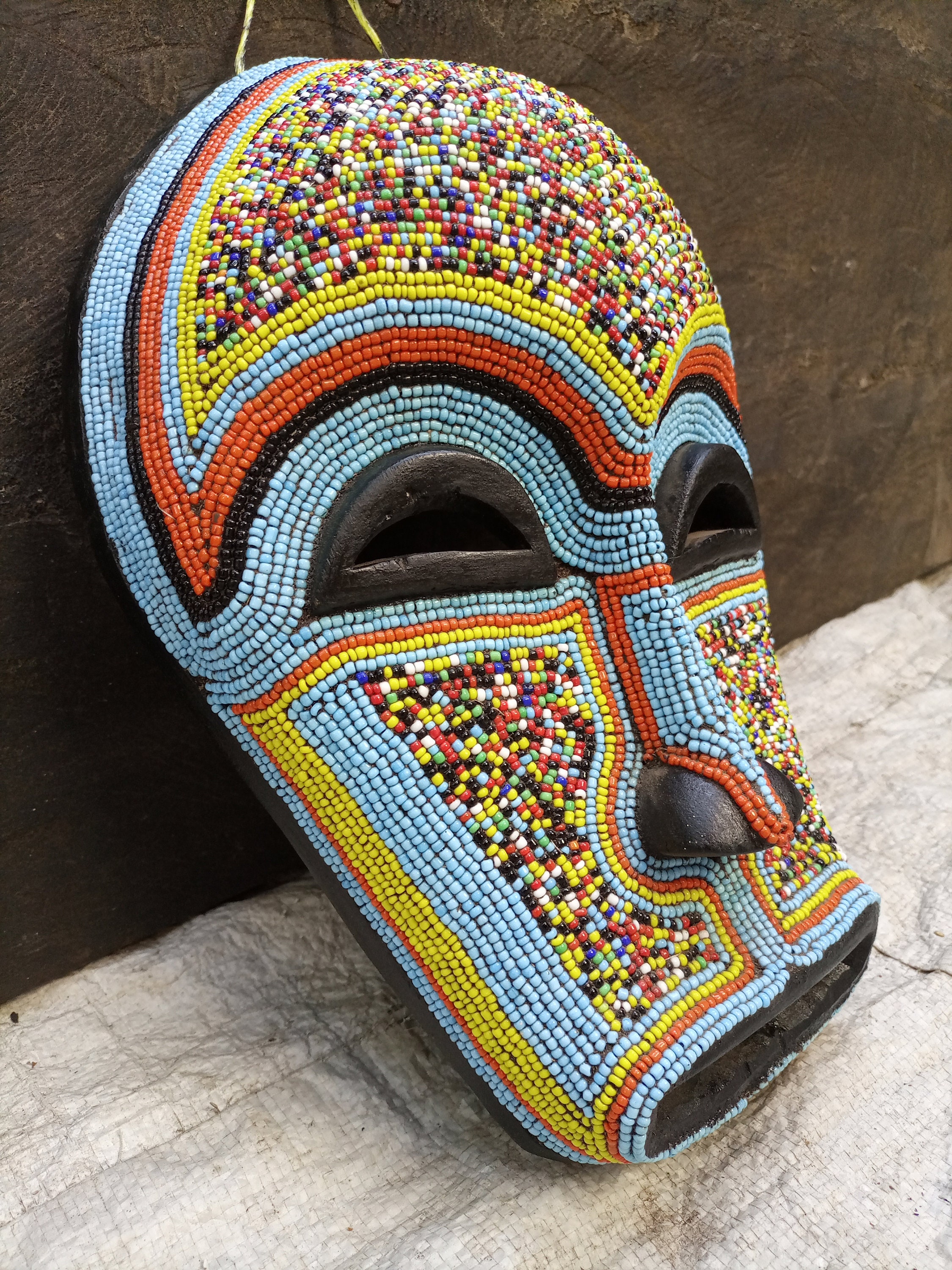 Tribal art, stand with African mask and garment Tribal a…