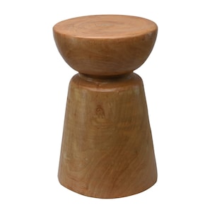 May include: A wooden stool with a rounded top and a wide, flared base. The stool is made of natural wood with a light brown finish.