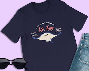 May include: A navy blue t-shirt with a cartoon stingray and the text "Let's name the species Mr. Ray The Jolliest Science Master".