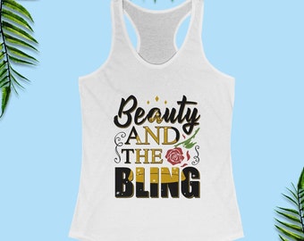 May include: White tank top with a black and gold graphic that says "Beauty and the Bling" with a red rose and gold swirls.