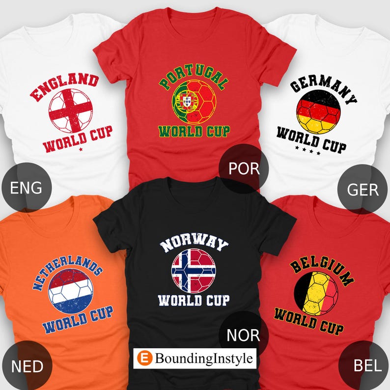 May include: A collection of short-sleeved t-shirts in various colors, each featuring a soccer ball design and the name of a country. The shirts include England, Portugal, Germany, Netherlands, Norway, and Belgium, with "World Cup" text.
