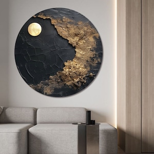 May include: A circular abstract painting with a black and gold color scheme. The painting features a textured surface with a large gold circle in the center.