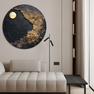 May include: A circular abstract wall art piece with a black and gold textured design. The art features a large, round, gold circle in the upper left corner.