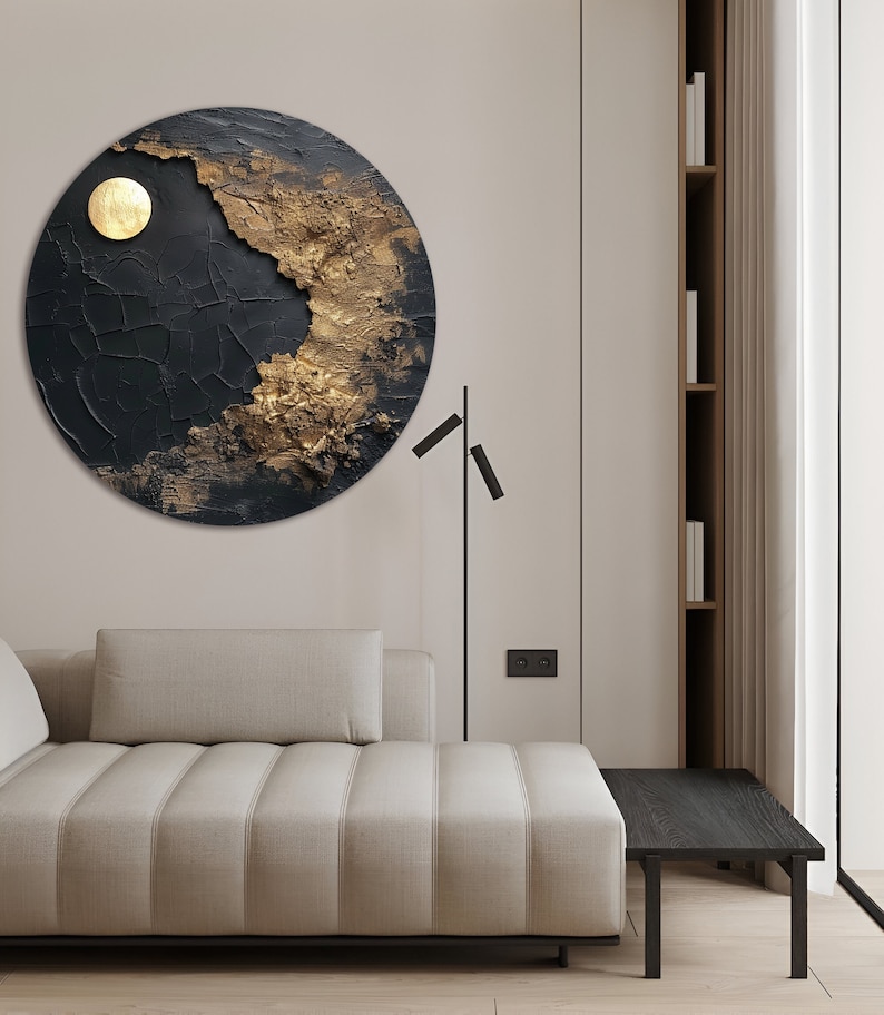 May include: A circular abstract wall art piece with a black and gold textured design. The art features a large, round, gold circle in the upper left corner.