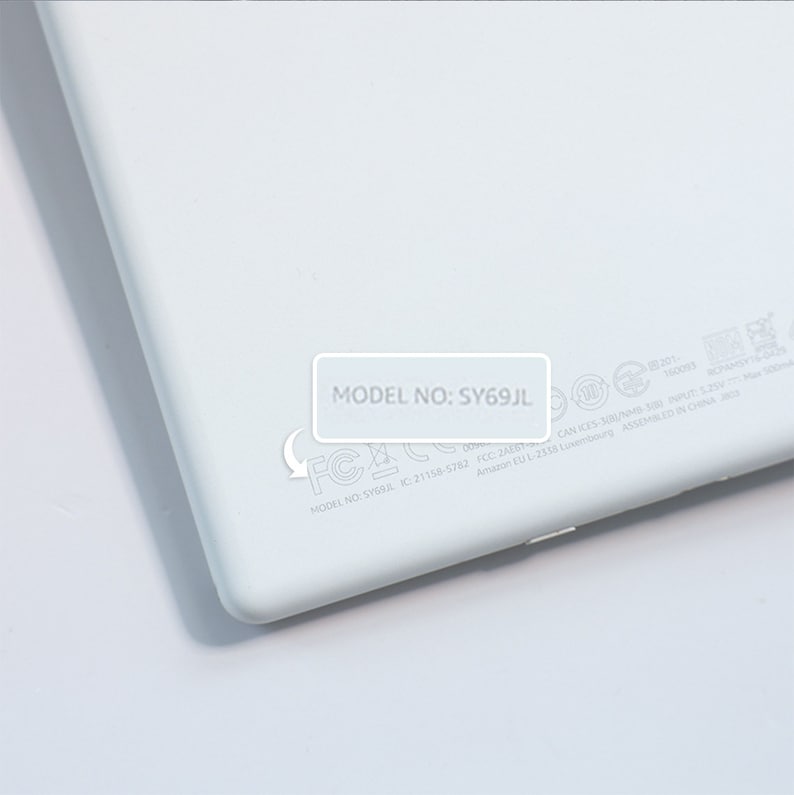 May include: White electronic device with the model number SY69JL printed on the back. The device has FCC and IC certification markings.