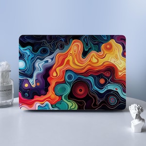 May include: A rectangular laptop skin featuring a vibrant, abstract design of swirling, fluid lines in shades of orange, yellow, red, blue, purple, and green. The pattern resembles topographic map contours with concentric circles and flowing waves.