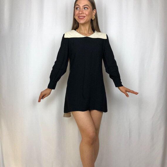 1960s black dress/top with white peter pan collar.