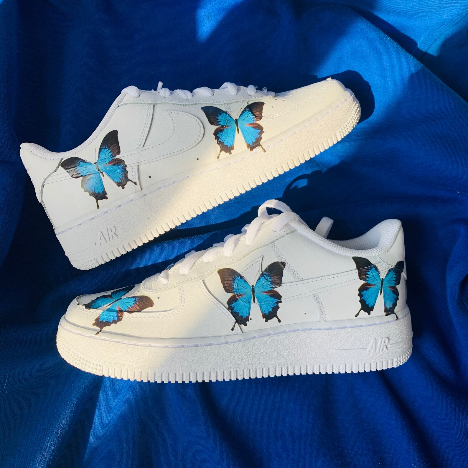 black air forces with butterflies