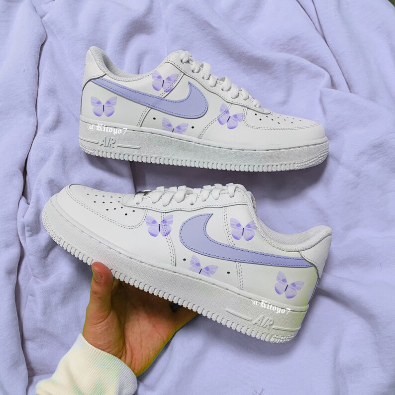 white shoes with blue butterflies
