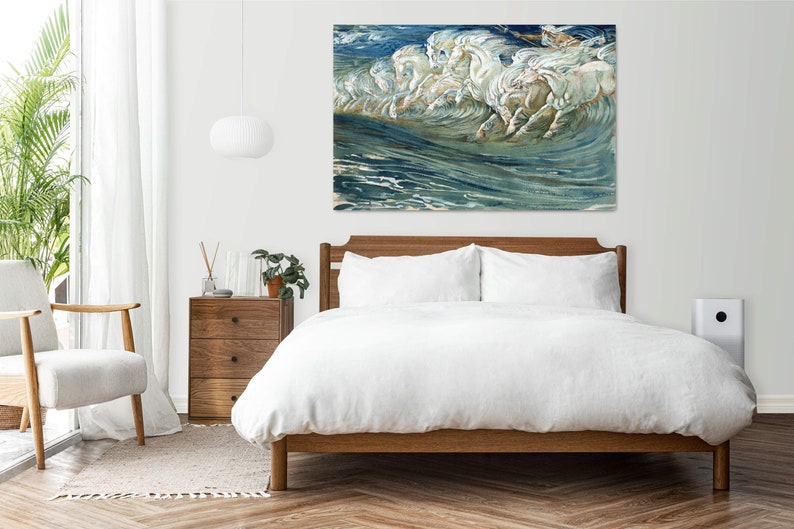 May include: A painting of white horses running through the ocean waves. The painting is in a modern bedroom setting above a bed with white bedding.
