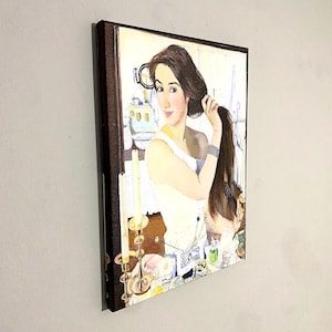 May include: A painting of a woman with long brown hair, wearing a white dress, looking at herself in a mirror. She is holding a brush in her right hand and is applying makeup. The painting is set in a bathroom with a vanity and candles.