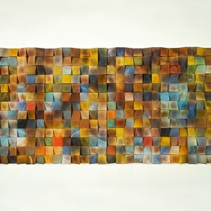 May include: A wall art piece made of wood with a mosaic of squares in various shades of brown, yellow, blue, and red.