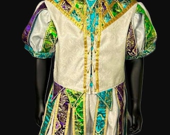 May include: A jester costume featuring a white doublet and matching breeches with a subtle damask pattern. The outfit is accented with green, purple, and gold brocade panels, gold trim, and a matching two-pointed jester hat with gold trim.