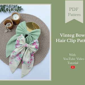 May include: Two fabric hair bows, one green and one with a floral print, on a brown woven surface. The text "PDF Pattern" and "Vintage Bow Hair Clip Pattern" is displayed above the bows. The text "With YouTube Video Tutorial" is displayed below the bows.