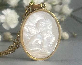 Gold necklace with white mother-of-pearl medallion. Vintage pendant with a mother-of-pearl angel. Guardian angel necklace in stainless steel. Lucky charm