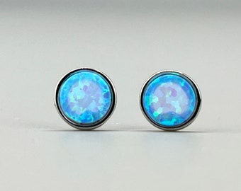 Minimalist earrings with a blue opal. 925 silver ear studs with a blue opal. Jewelry with an opal disk.