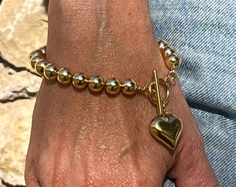 Bracelet grosse chaine de bille avec un cœur en acier inoxydable. Bracelet or tendance. Cadeau pour elle. Bracelet avec pendentif cœur.
