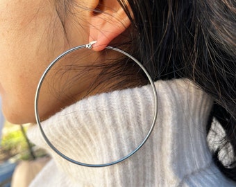 Large classic stainless steel hoop earrings. Oversize hoop 68 mm and 50 mm in stainless steel.