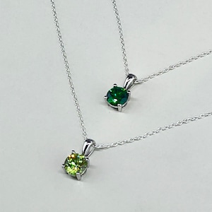 Necklace with peridot-colored zircon and emerald. 925 sterling silver necklace with green stone. Birthstone for August, birthstone for May.