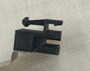 Reemplazo de la abrazadera del material de la impresora Roland