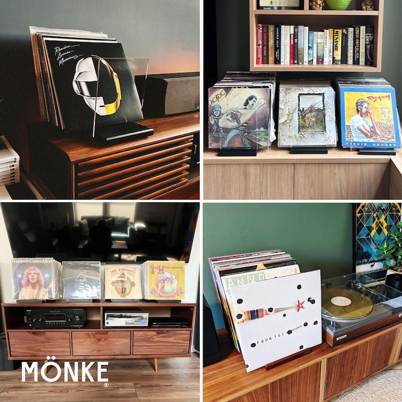 May include: A collection of vinyl record albums displayed on wooden furniture. The albums are in clear acrylic stands. The image includes a Daft Punk album cover, and the word "M&Ouml;NKE" is visible in the bottom left corner.