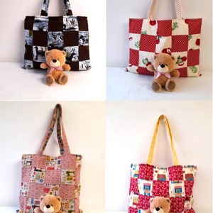 May include: Four tote bags with patchwork designs and teddy bears. The bags are made of different fabrics and have different patterns. The teddy bears are all brown and have pink ribbons around their necks.