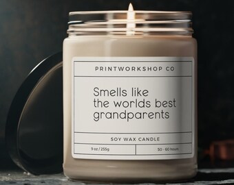 May include: A soy wax candle in a clear glass jar with a white label that reads "PRINTWORKSHOP CO" and "Smells like the worlds best grandparents". The candle is 9 oz/255g and has a burn time of 50-60 hours.