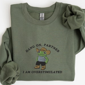 Hold On Partner I’m Overstimulated Embroidered Sweatshirt, Cowboy Frog Unhinged Shirt, Weirdcore Gen Z Crewneck Sweatshirt, Funny Frog Shirt