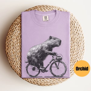 Capybara Riding Bike Shirt Capybara Gift Animal Lover Gift Capybara Tee Capybara T-Shirt Funny Animal Lover T-Shirt Rodent Shirt Orchid