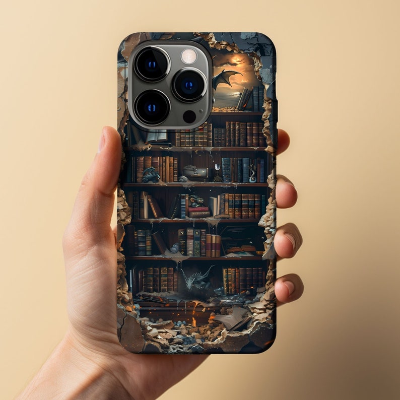 May include: A phone case featuring a broken wall design revealing a bookshelf filled with books and a dragon. The phone case has a black camera housing with three lenses.