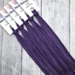 May include: Five spools of hand-dyed 100% cotton embroidery floss in a deep purple shade. The spools are labelled "Stitchys" and "Vintage Purple".