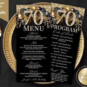 May include: Black and gold menu and program cards for a 70th birthday celebration. The menu lists starters, main courses, desserts, and drinks. The program outlines the order of events. The cards are on a gold-rimmed plate.