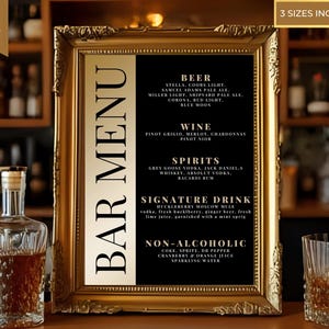 May include: A framed bar menu with a gold ornate frame. The menu features a black background with white text listing beer, wine, spirits, a signature drink, and non-alcoholic options. The text "BAR MENU" is displayed vertically on the left side.