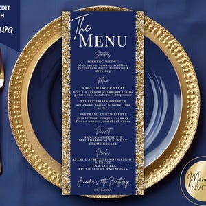 May include: A navy blue menu card with gold glitter trim, featuring a menu for Jennifer's 30th birthday. The menu is on a gold-rimmed plate with gold cutlery. The text includes starters, main courses, dessert, and drinks.