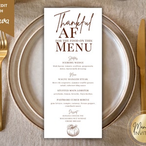 May include: A printable Thanksgiving menu template with a brown and white color scheme. The menu features a handwritten title "Thankful AF for the food on this menu". The menu includes starters, main courses, and desserts. The menu is designed to be self-edited with Canva.