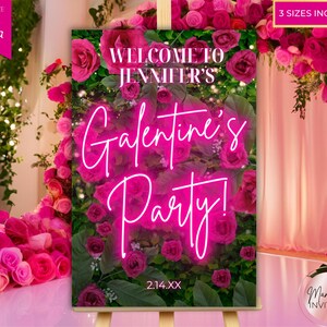 以下が含まれることがあります： ピンク色のGalentine's Partyの看板。テキスト「Welcome to Jennifer's」と「Galentine's Party!」がネオン風フォントで表示されています。看板はピンク色のバラと緑に囲まれ、下部には日付2.14.XXがあります。