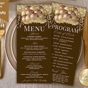 May include: Two brown and gold party menu and program cards with gold text and balloon graphics. The menu includes a list of food and drinks. The program lists the order of events. Gold cutlery and a plate are in the foreground.