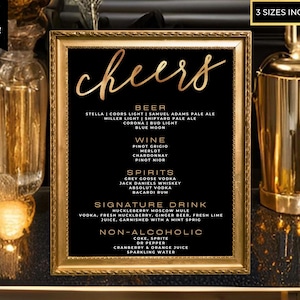 May include: A black and gold printable sign with the word "cheers" in gold script. The sign lists various beer, wine, and spirit options, as well as a signature drink and non-alcoholic options.