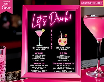 May include: A pink framed sign with the words "Let's Drink!" in neon script. The sign lists signature drinks, including a Cosmopolitan Cocktail and Strawberry Mojito, along with wine, beer, spirits, and non-alcoholic options. The sign also includes the text "3 sizes included."