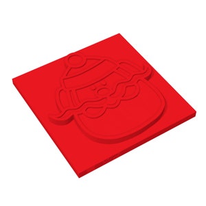 May include: Red rubber stamp with a raised design of a snowman wearing a hat and scarf.