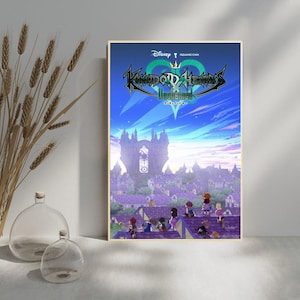 May include: A framed poster featuring the "Kingdom Hearts Unchained" video game. The artwork depicts a fantasy cityscape under a blue sky, with characters on rooftops. The poster includes the Disney and Square Enix logos.