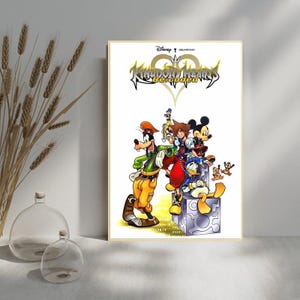 May include: A framed poster featuring characters from the Kingdom Hearts Re:coded video game. The artwork includes Goofy, Sora, Mickey Mouse, Donald Duck, and other characters. The title "Kingdom Hearts Re:coded" is displayed at the top of the poster.