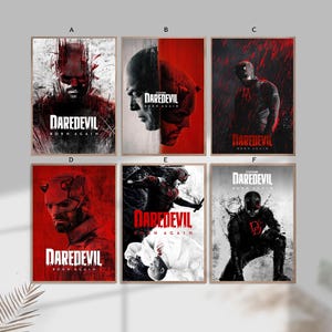 Puede incluir: Seis carteles enmarcados con ilustraciones de la serie Daredevil. Cada cartel presenta una imagen diferente del personaje, con el título "Daredevil Born Again". La paleta de colores es principalmente roja, negra y blanca.