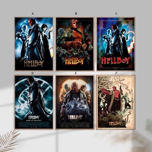 May include: Six framed movie posters featuring the character Hellboy. The posters have different designs and color schemes, with the title "Hellboy" prominently displayed. Some posters include additional text, such as "Here to Protect".
