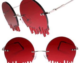 Tropfende geschmolzene runde rote Gläser