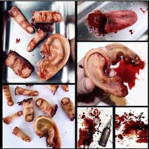 May include: A collection of realistic Halloween props: severed fingers, an ear, and a tongue, all with a bloody appearance. The props are arranged on different surfaces, with splatters of fake blood enhancing the effect. A bottle of fake blood is also present.