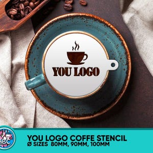 May include: A white coffee stencil with the text "YOU LOGO" and a small coffee cup icon. The stencil is on a blue and brown ceramic saucer. The stencil is available in three sizes: 80mm, 90mm, and 100mm.