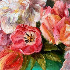 May include: A close-up of a still life painting featuring a bouquet of pink and red tulips in a green vase. The flowers are painted with thick brushstrokes, creating a textured effect.